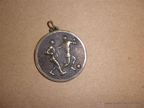 Antigua medalla relieve Continuara.org