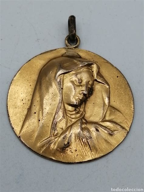Antigua medalla religiosa Continuara.org