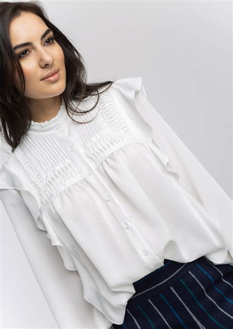 Blusa blanca volantes Continuara.org