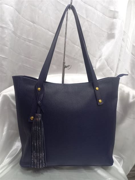 Bolso azul oscuro Continuara.org