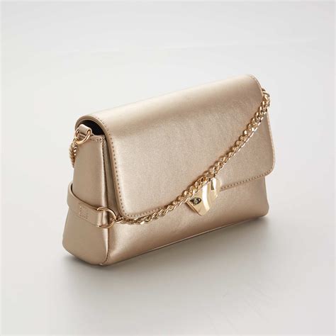 Bolso mano dorado Continuara.org
