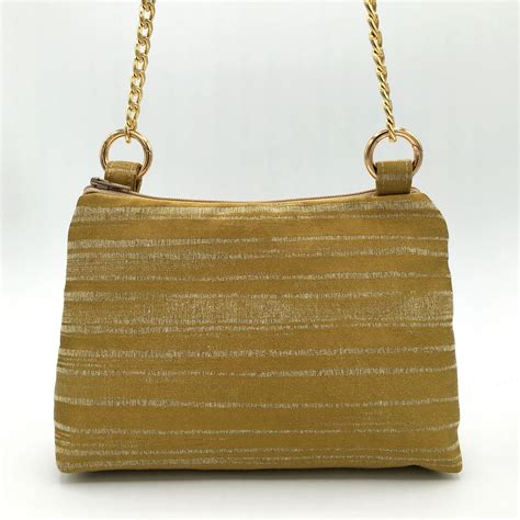 Bolso tela dorado Continuara.org