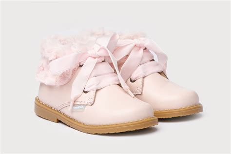 Bota rosa cordones Continuara.org