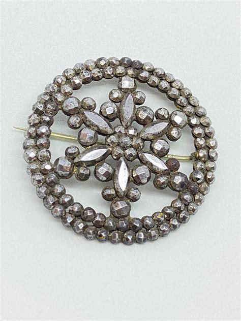 Broche acero piedras Continuara.org