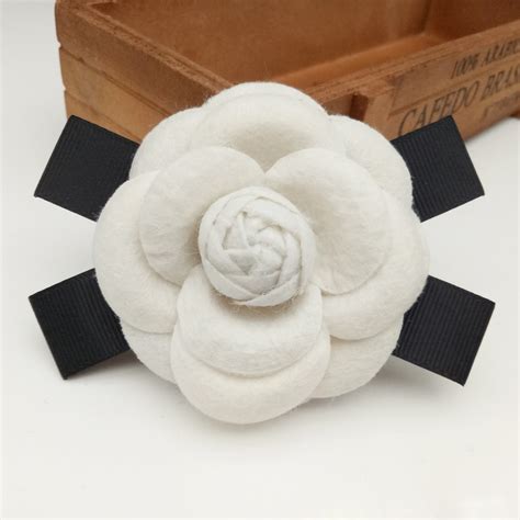 Broche tela Continuara.org