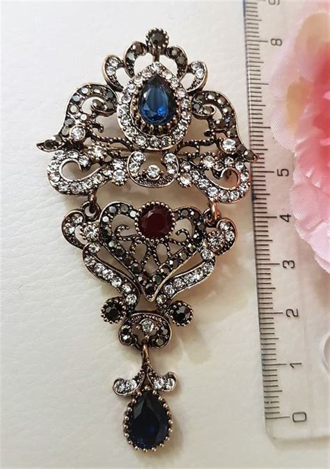Broche vintage retrato Continuara.org