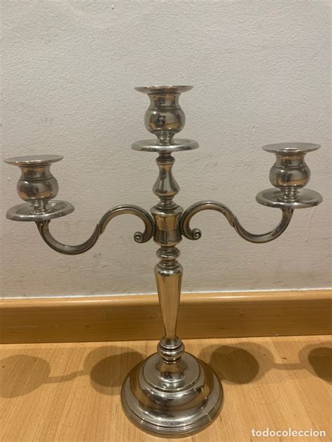Candelabros banados plata Continuara.org