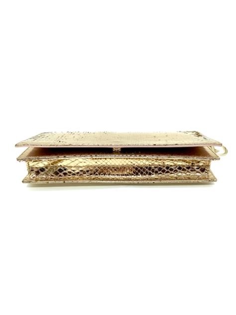 Clutch piel serpiente Continuara.org