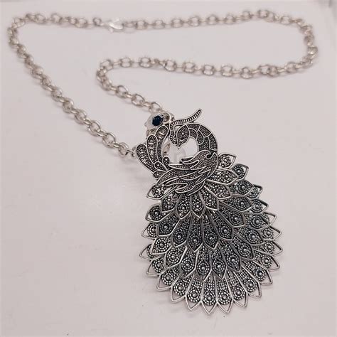 Colgante plata pavo Continuara.org