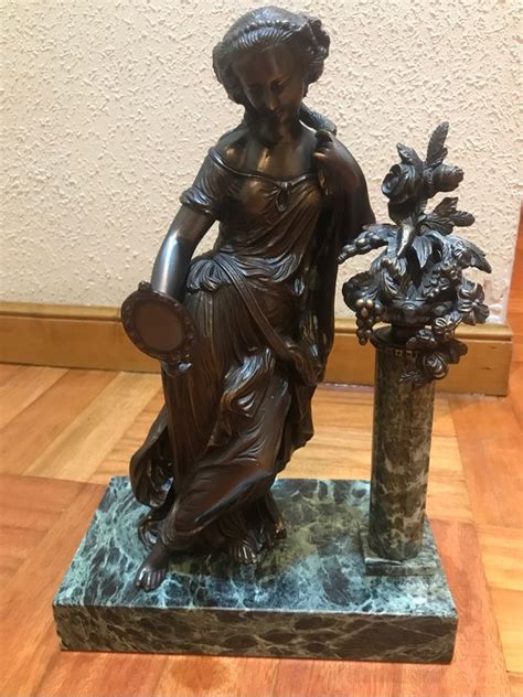 Figura bronce marmol Continuara.org