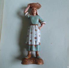 Figura mujer cesto Continuara.org