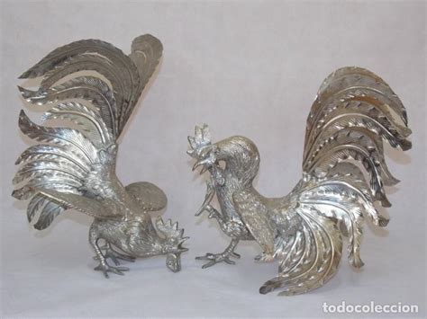 Gallos figuras metal Continuara.org