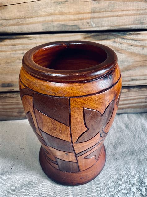 Jarrones esculturas madera Continuara.org