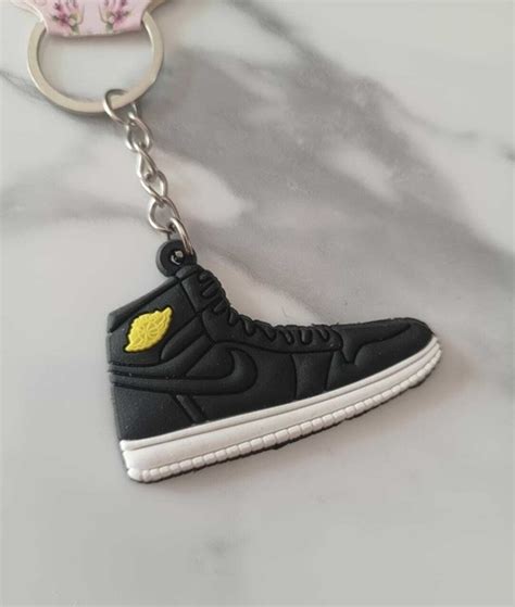 Llavero zapatilla nike Continuara.org
