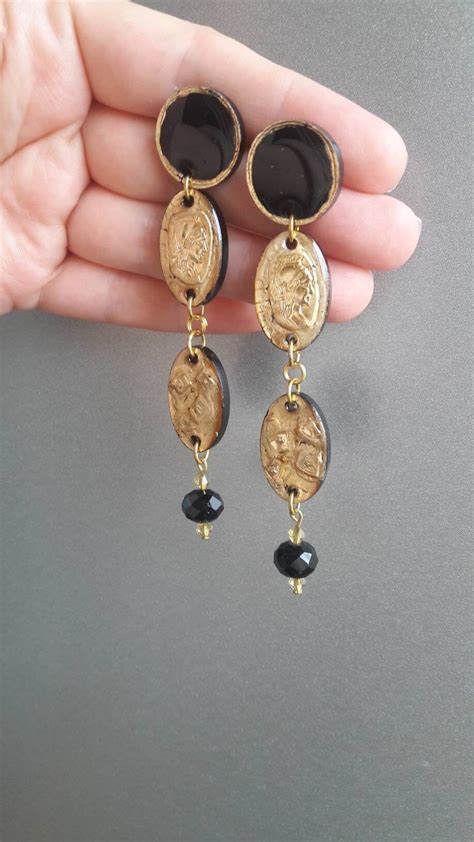 Pendientes estilo antiguo Continuara.org