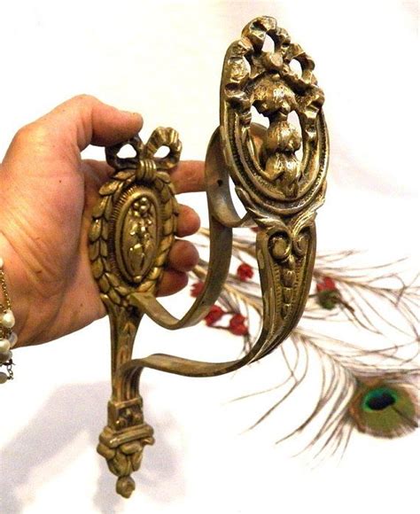 Perchas antiguas bronce Continuara.org