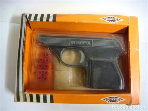 Pistola juguete interpol Continuara.org