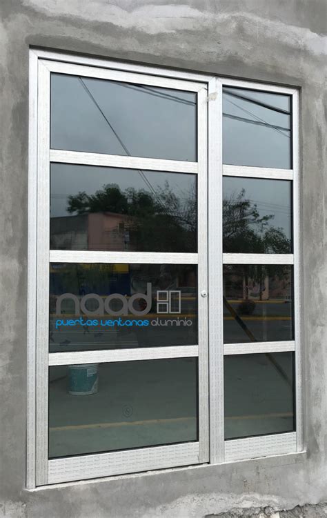 Puerta aluminio Continuara.org
