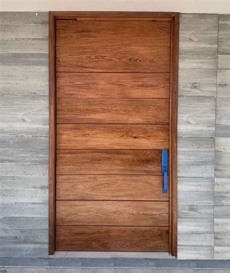 Puerta madera Continuara.org
