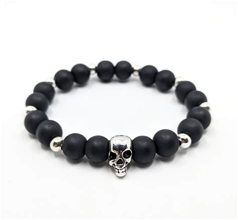 Pulsera negra calavera Continuara.org