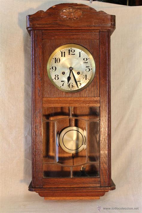 Reloj antiguo madera Continuara.org