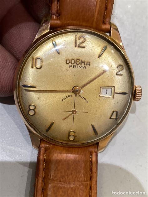 Reloj dogma Continuara.org