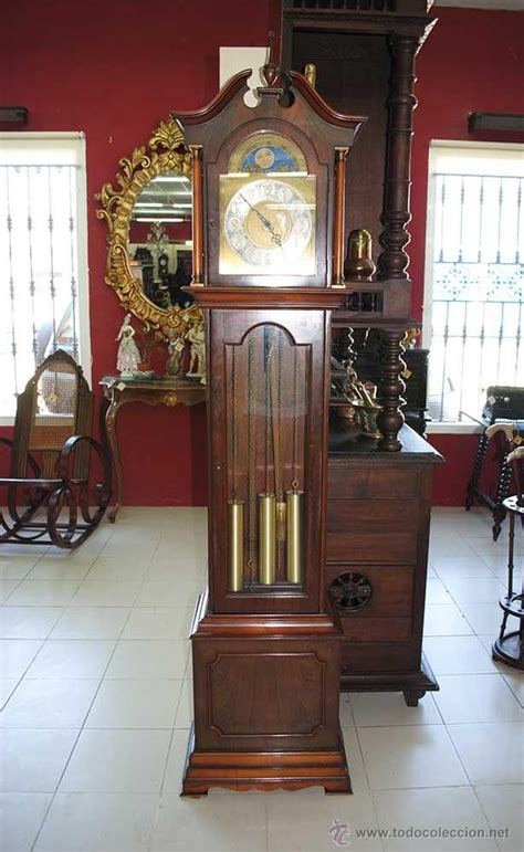 Reloj pie pendulo Continuara.org