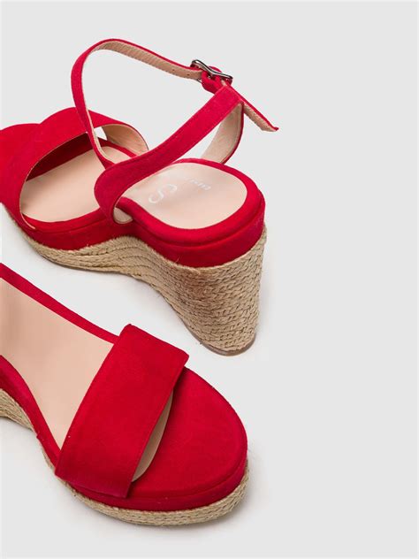 Sandalias rojas Continuara.org
