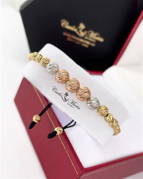 Tres pulseras oro Continuara.org