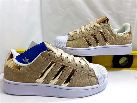 Zapatillas adidas doradas Continuara.org
