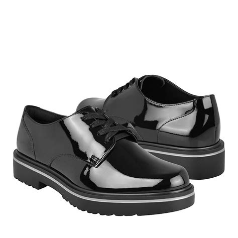 Zapatos negros Continuara.org
